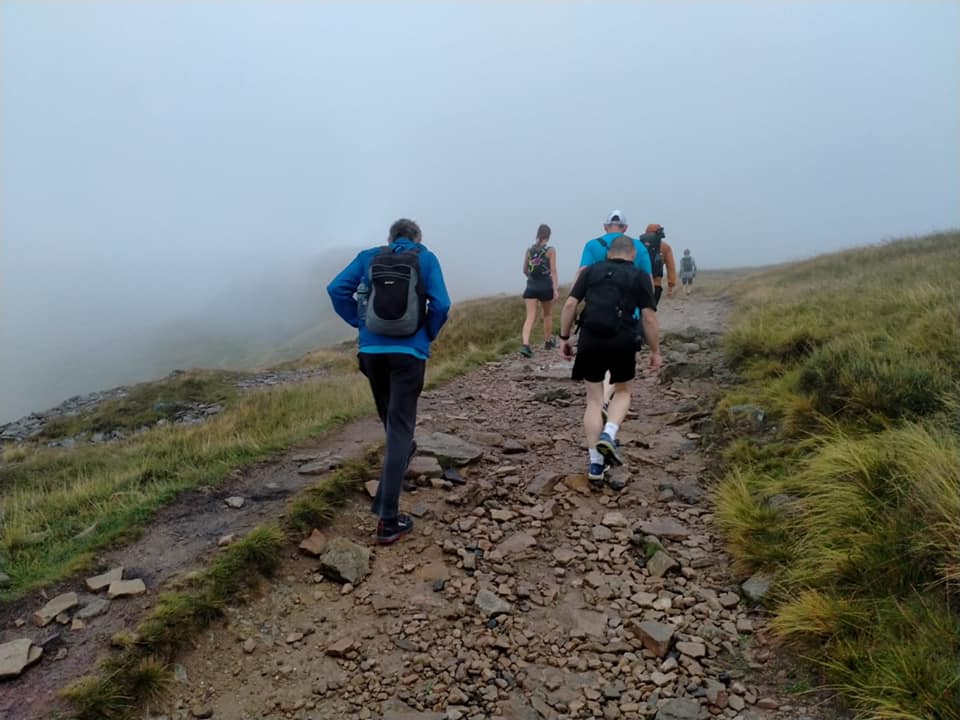 Yorkshire 3 Peaks Challenge Striders on way up to top